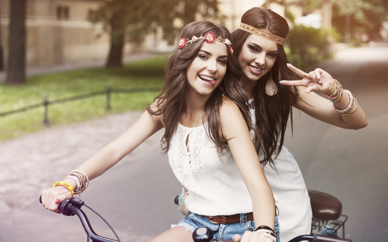 women outdoors, tongues, long hair, wreaths, white dress, bicycle, brunette, women, urban, couple, looking at viewer, teeth, model, jean shorts, winner