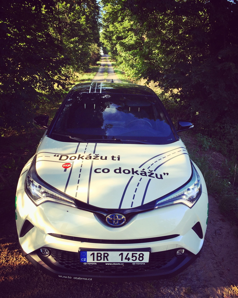 land vehicle, 2K, motor vehicle, western script, c-hr, toyota c-hr, outdoors, hybrid, nature, toyota, communication, white, greengreen car, no people