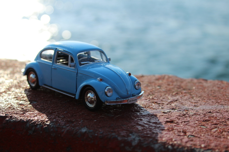 5K, outdoors, selective focus, close-up, mandatory, day, land vehicle, car, beach, motor vehicle, nature, sea, comb, bagel, toy, mode of transportation