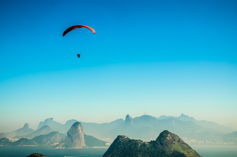 freedom, leisure activity, beauty in nature, parachute, blue, brazil, sport, rio de janeiro, landscape, flying, christ the redeemer, mountain range, city
