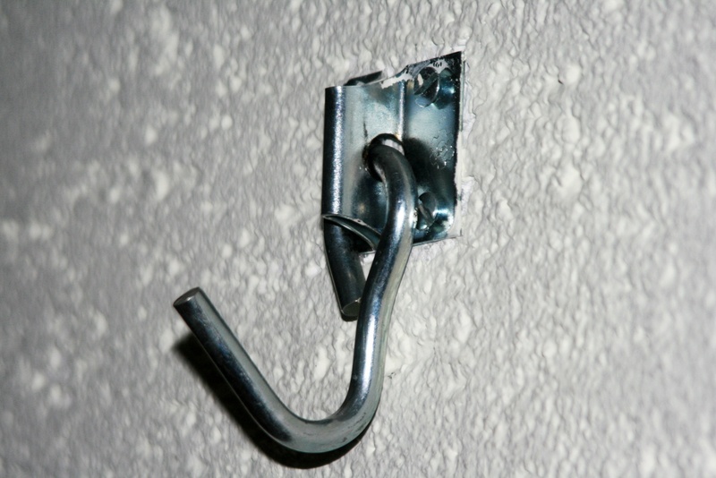 shiny, black color, check mark, no people, close-up, entrance, simplicity, safety, door, old, protection, metal, 2K, hang, indoors, high angle view, security
