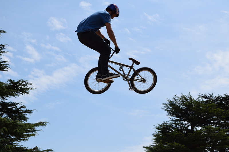 lifestyles, bMX Cycling, nature, full length, stunt, leisure activity, bicycle, sky, danger, sports Helmet, low angle view, transportation, action, risk
