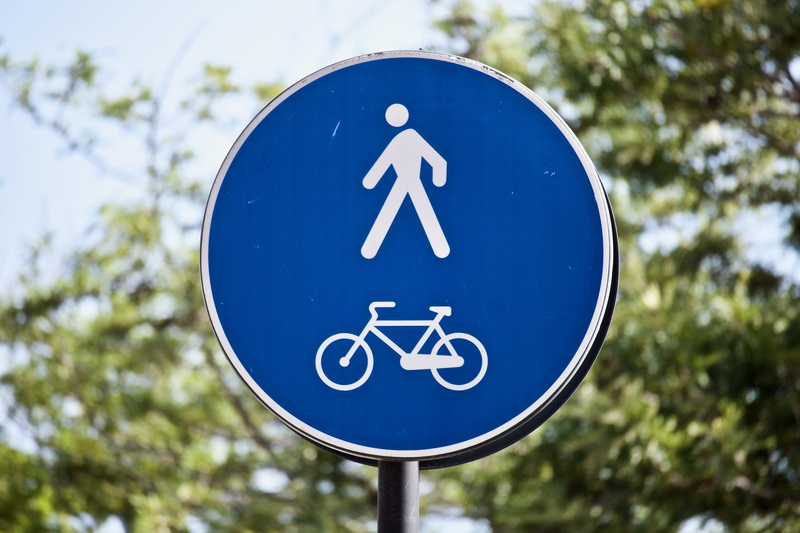 sign, cycle track, human representation, circle, bicycle, road sign, focus on foreground, street sign, symbol, cycling, 5K, design, guidance, day, tree