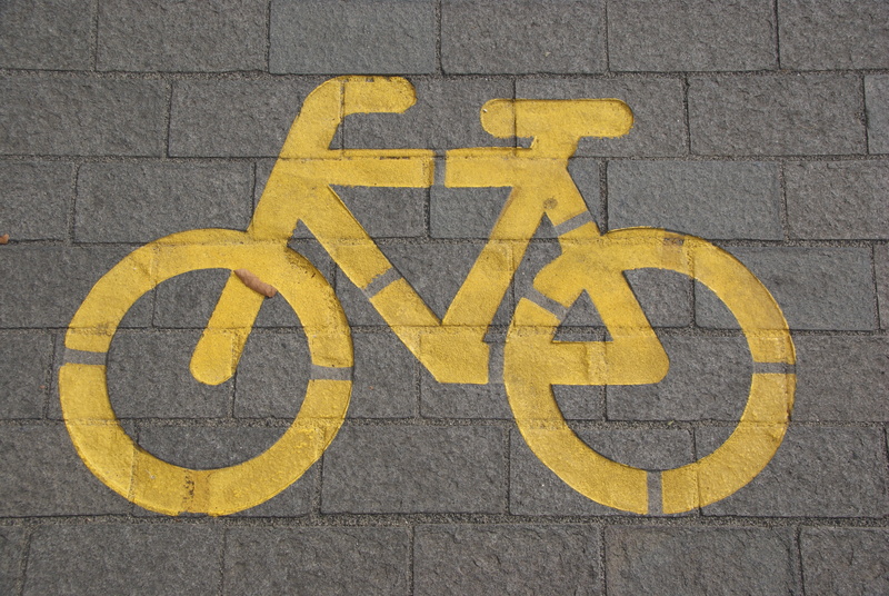 marking, bike, information, city, symbol, signage, outdoors, traffic, close-up, architecture, road marking, street, wall - building feature, yellow, cyclist