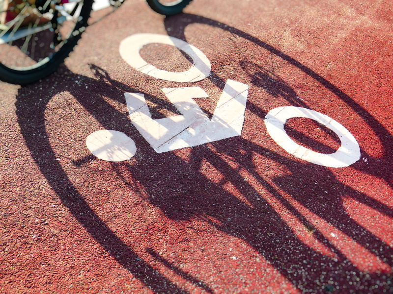 road, healthy, way, street, recreational, metal, sunlight, number, single object, close-up, shadow, symbol, shape, table, nature, lane, textured, sign