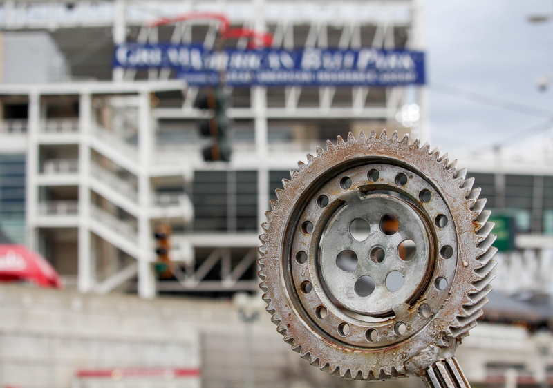 no people, building exterior, focus on foreground, cog, car, land vehicle, metal, street, steel, city, day, 4K, travel, transportation, machinery, tire