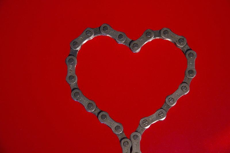 shape, emotion, metal, togetherness, heart shape, chain, no people, gray, studio shot, silver colored, silver - metal, bike chain, heart, positive emotion