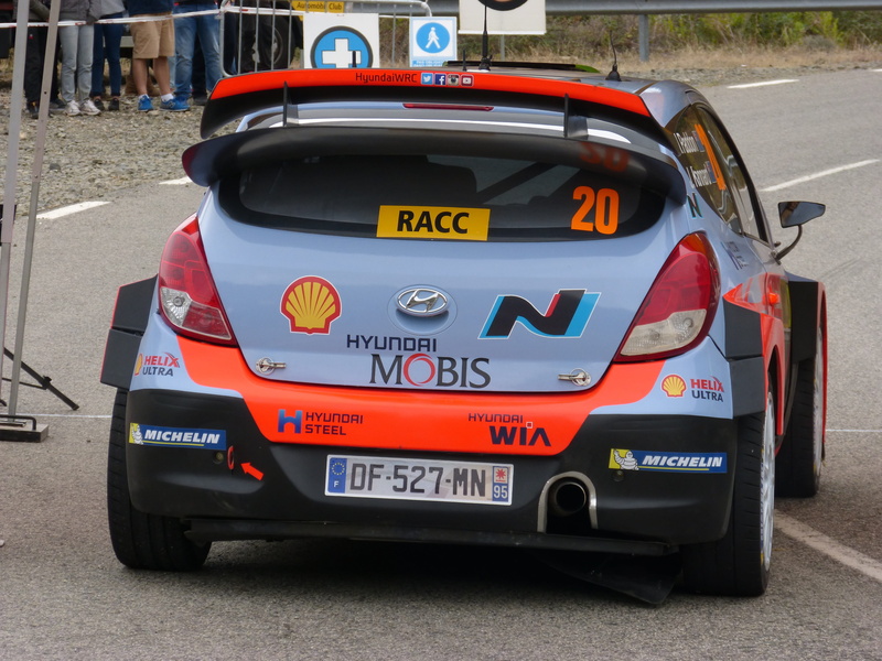 text, rear, red, motor vehicle, car, 4K, number, sign, road, hyundai, rally catalunya, wrc, no people, street, outdoors, transportation, output, western script