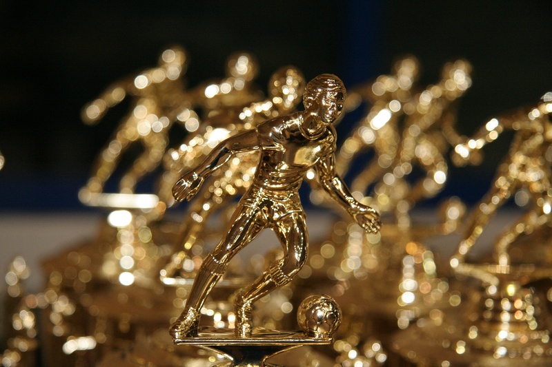 jewelry, football, indoors, no people, business, focus on foreground, gold Colored, creativity, trophies, reflection, silver colored, metal, necklace, shiny