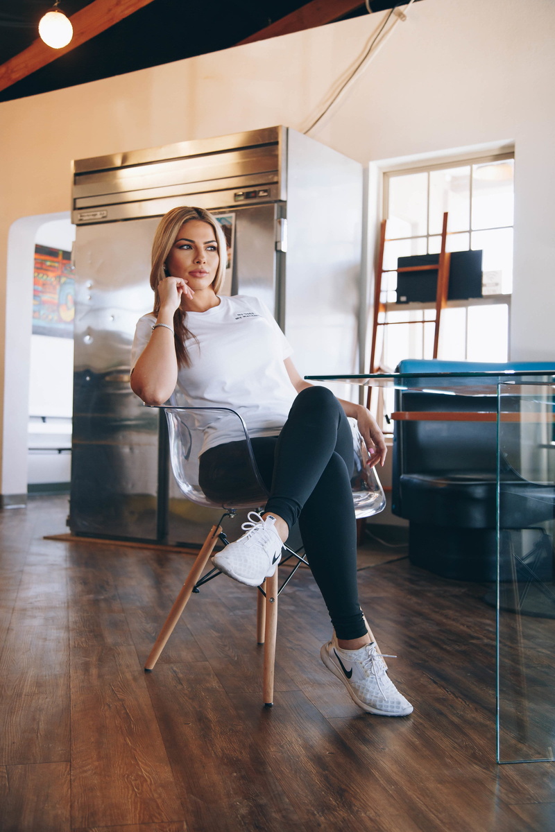 young adult, women, flooring, one person, hairstyle, setting, seat, adult, female, chair, armchair, young women, sitting, communication, full length, black