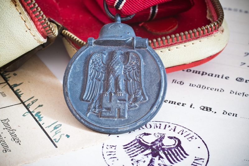 western script, achievement, studetenland, wealth, communication, finance, ostmedaille, medal, coin, history, economy, business, indoors, metal, still life