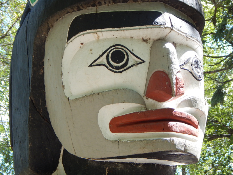 canada, male likeness, outdoors, human representation, indigenous, focus on foreground, art, day, close-up, totem pole, anthropomorphic face, sculpture