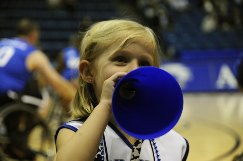 headshot, outdoors, girl, one person, hair, childhood, uniform, youth, sport, cheerleader, team, cute, incidental people, basketball, day, innocence, megaphone