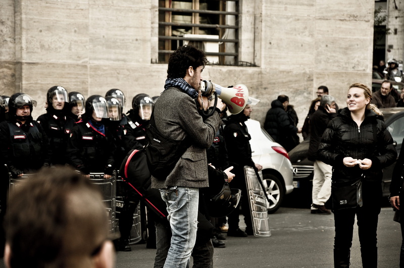 person, the media, wheel, crash helmet, footwear, megaphone, television camera, machine, officer, filming, camera operator, suit, group of people, technology