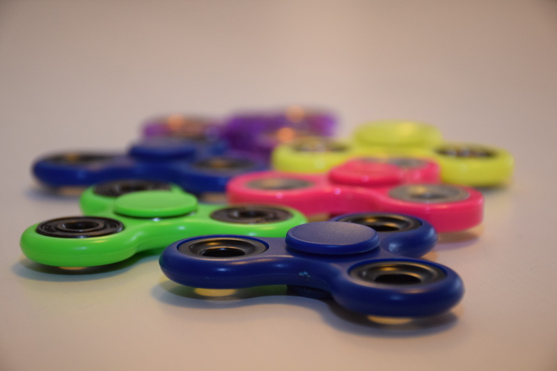 multi colored, abundance, blue, table, entertainment, large group of objects, spinning, close-up, colored background, kid, childs play, still life, choice