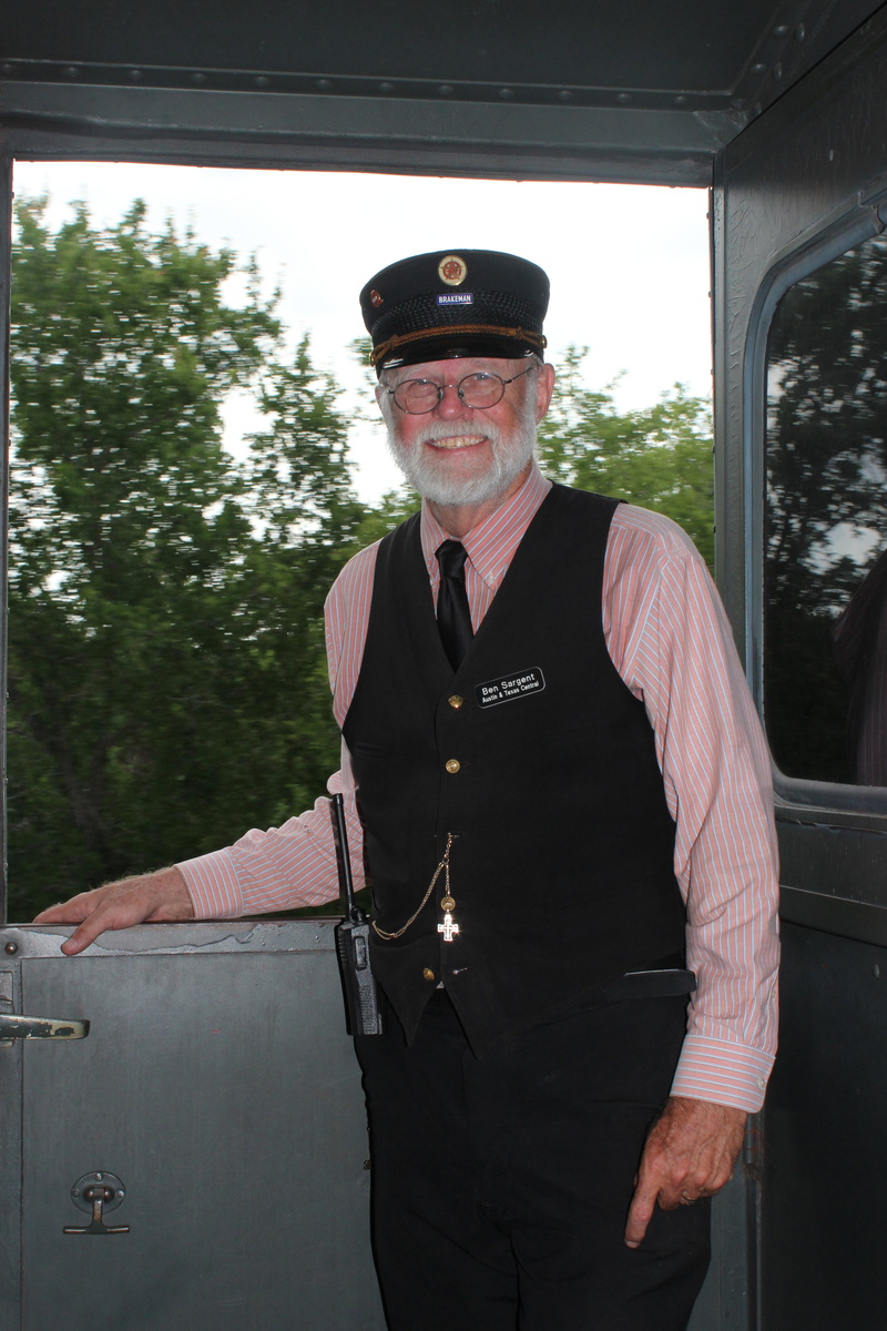 front view, uniform, mature men, train, senior men, looking at camera, men, 5K, clothing, real people, traditional, mature adult, smiling, historic, conductor