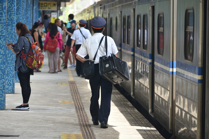 outdoors, city, train, walking, railroad station, driver, women, people, public transportation, uniform, full length, adult, casual clothing, group of people