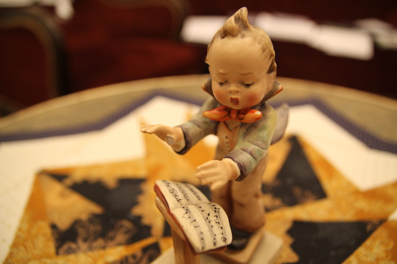 high angle view, porcelain, innocence, creativity, sitting, indoors, text, art and craft, baby, close-up, childhood, child, conductor, 5K, sculpture, offspring