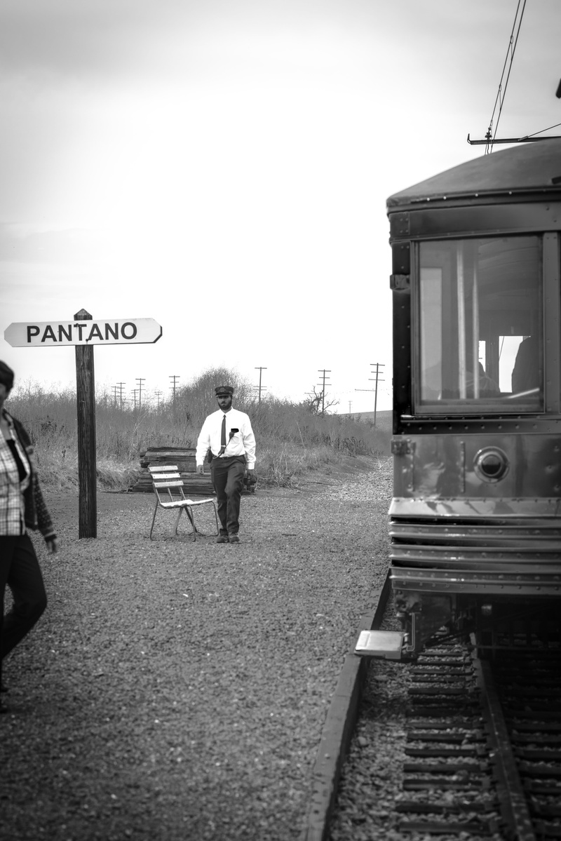 railroad, rear view, track, monochrome, outdoors, train tracks, person, railway, sky, real people, locomotive, mode of transportation, travel, transportation system