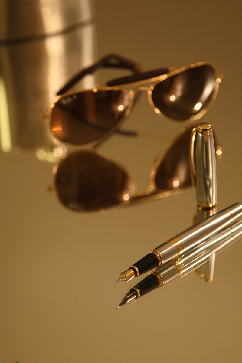 Sunglasses, colored background, Business, table, still life, close-up, equipment, 2K, selective focus, fashion, group of objects, metal, indoors, writing instrument