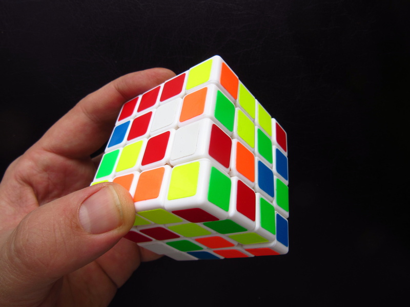 human hand, 4K, indoors, four, patience, cube shape, finger, toy, human body part, studio shot, hand, unrecognizable person, strategy, cube, leisure activity