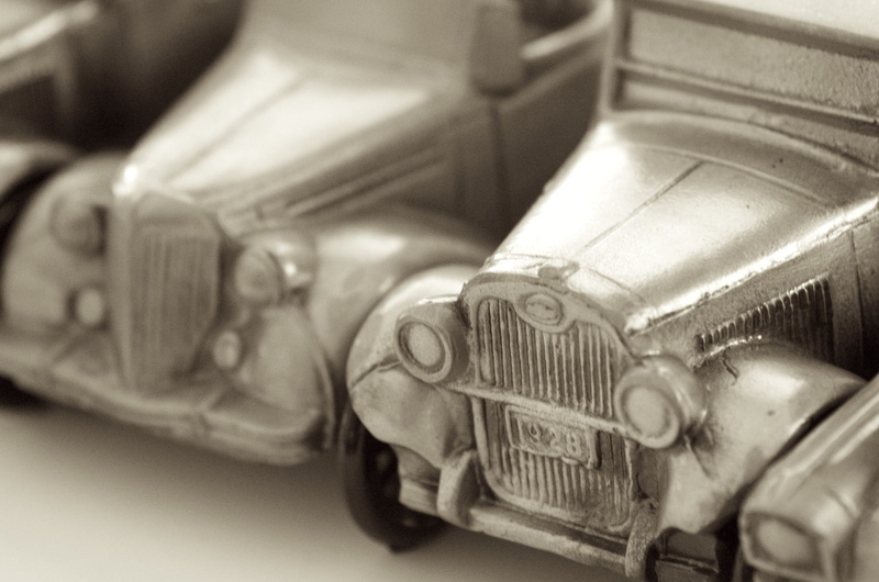 indoors, decorative, no people, number, still life, sepia toned, close-up, ornamental, 1080P, metal, selective focus, toy, group of objects, studio shot