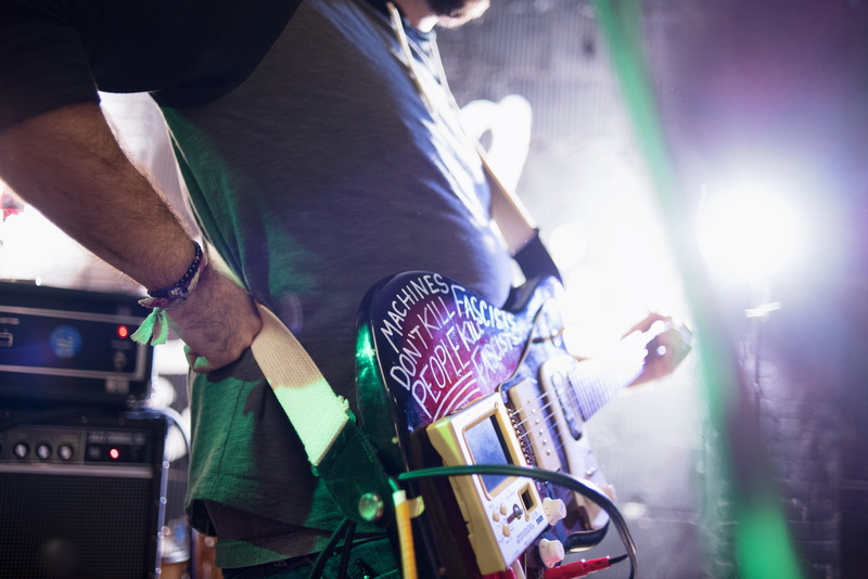 concert, rock, string instrument, arts culture and entertainment, midsection, holding, electric guitar, nightlife, musical equipment, music, live, one person