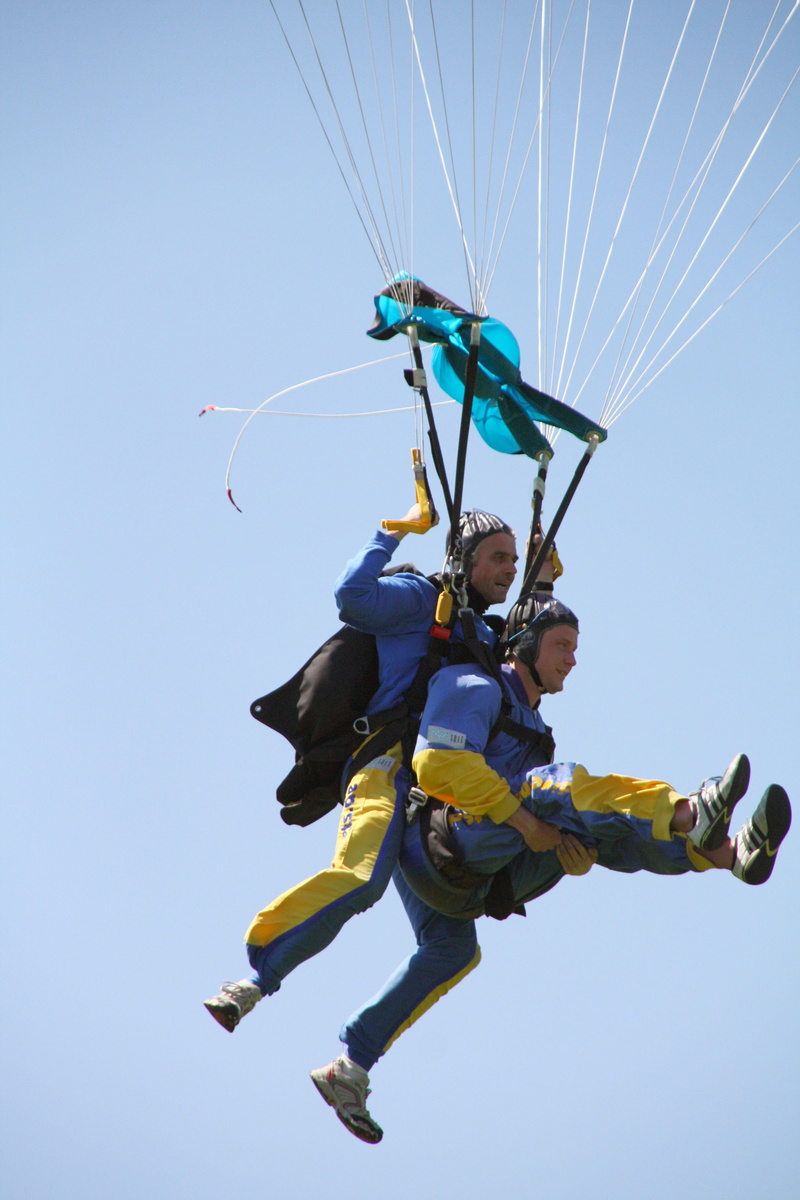 outdoors, low angle view, blue, parachute, arms raised, adrenaline, paratrooper, air, human, high feeling, mid-air, freedom, dom, leisure activity, excitement