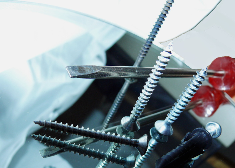repair, silver colored, land vehicle, no people, head, metal, tool, selective focus, phillips, bicycle, equipment, table, wheel, day, screws, screw, studio shot