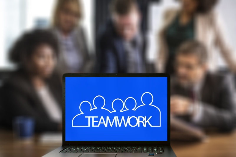 partnership, group of people, teamwork, sign, sitting, business, office, incidental people, cooperation, community, computer, success, focus on foreground