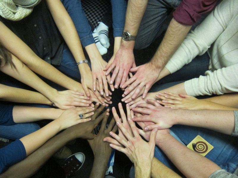 team spirit, human arm, touching, community, young adult, human limb, cooperation, togetherness, connection, teamwork, unity, group of people, teenager