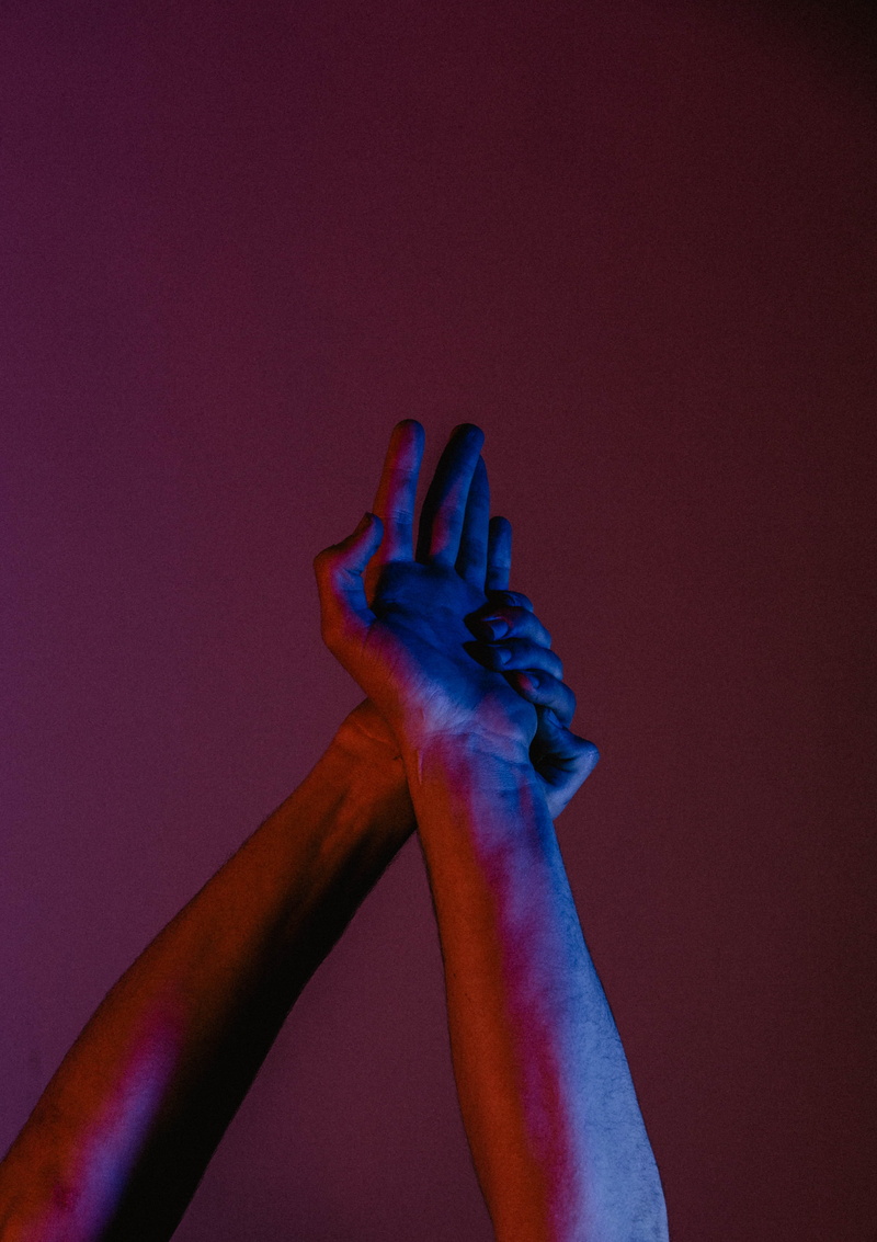 person, leisure activity, indoors, copy space, body part, holding, stretching, blue, two, human limb, human finger, red, personal perspective, light, model