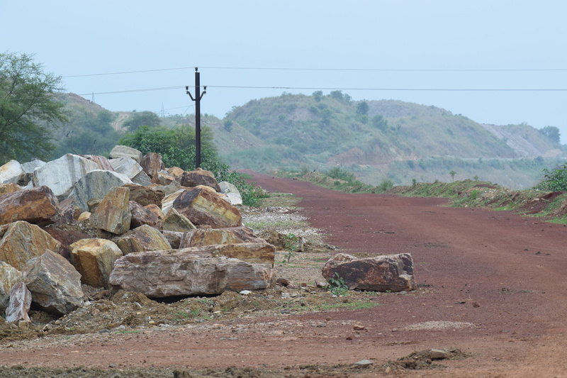 fuel and power generation, day, landscape, solid, rock - object, electricity pylon, village, land, rock, india, nature, power supply, technology, road