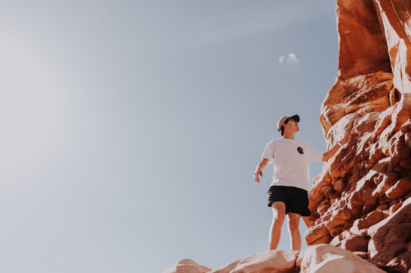 real people, sport, nature, people, young adult, day, lifestyles, casual clothing, one person, jersey, rock - object, sunlight, leisure activities, leisure activity
