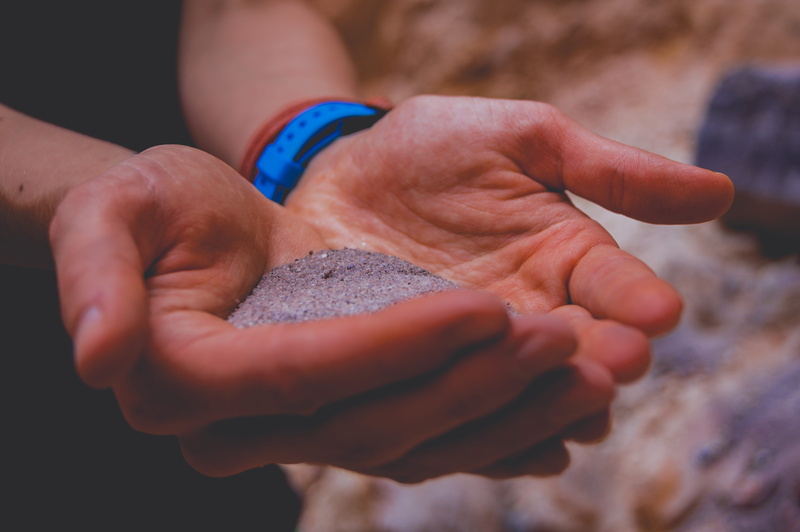 finger, sand, colorful, tan, background, human hand, white, real people, body part, orange, human body part, purple, midsection, selective focus