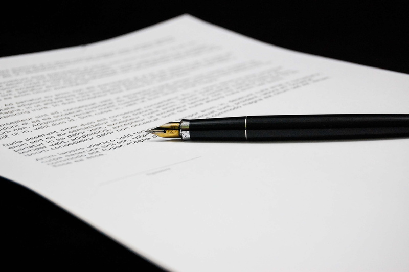 responsibility, correspondence, documents, signing, agreement, black background, contract, signature, studio shot, writing, writing instrument, paper, ink