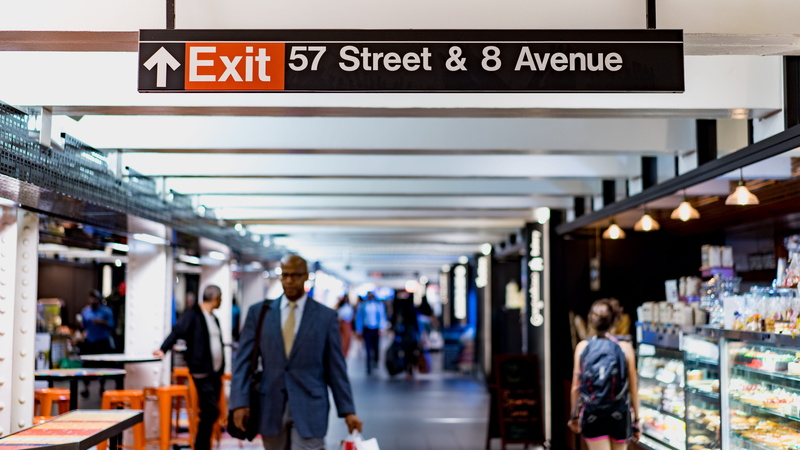 man, transportation, women, men, group of people, signage, retail, person, tunnel, shop, sign, store, focus, business, avenue, walkway, western script