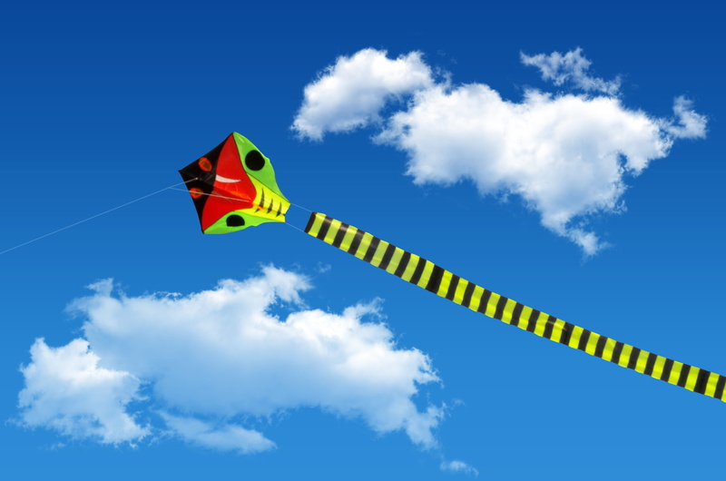 kite - toy, inflatable, day, venturing, color, fun, motion, flying, shape, blue, flag, sign, wind, children, communication, kite, green, low angle view