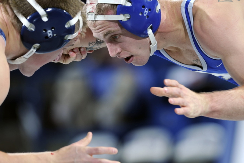 looking, clothing, sports, college, wrestle, two, competition, athlete, teamwork, concentration, wrestling, cooperation, looking down, group of people