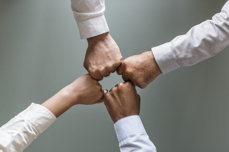 handshake, two people, togetherness, four, human body part, gray background, strength, cooperation, men, business, people, adult, close-up, indoors, group