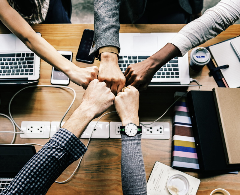 adult, colleagues, meeting, fist bump, group of people, collaboration, achievement, diverse, cooperation, digital device, men, arms, man, indoors, deal