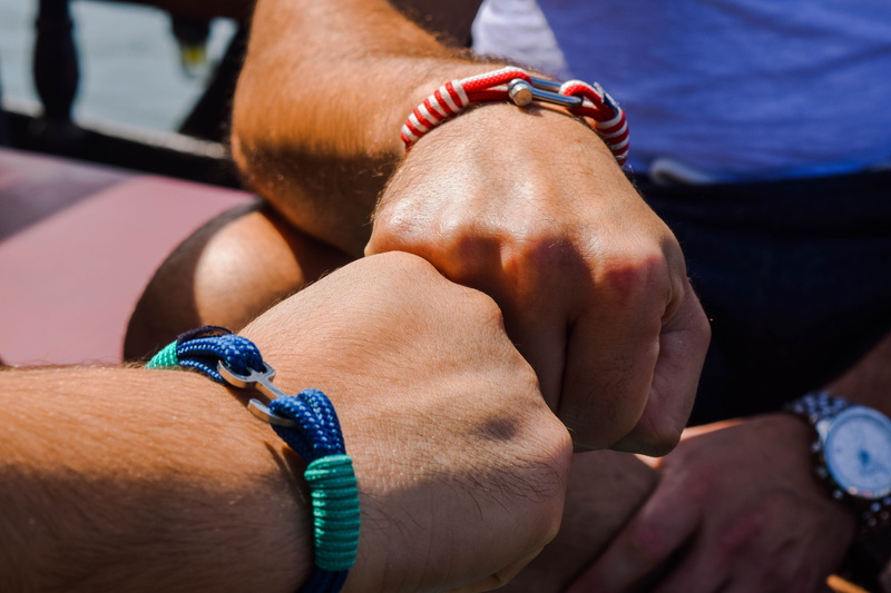 two people, real people, skin, people, men, greece, women, young adult, person, close-up, hands, close, human hand, day, bump, bonding, bracelets, man