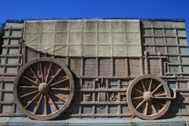geometric shape, old-fashioned, architecture, the past, ox wagon, granite, mode of transportation, day, relief, wheels, historic, nature, cart, no people