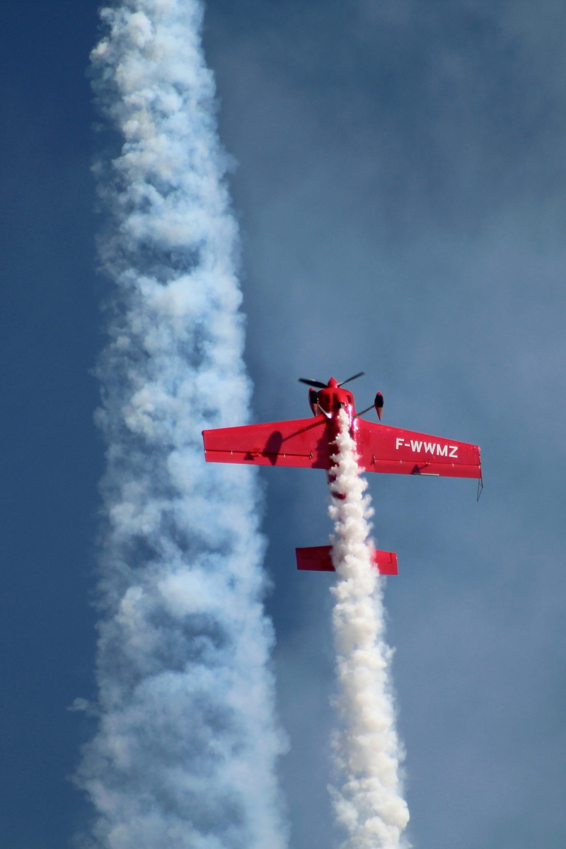 aerobatics, flying, propeller, mode of transportation, aviation, motion, smoke - physical structure, meeting park, aircraft, airshow, sky, cloud - sky
