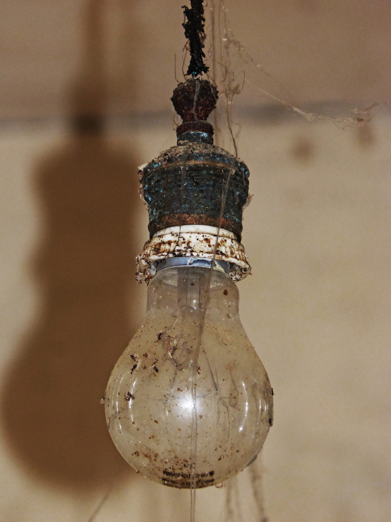 lighting equipment, electricity, rusty, single object, close-up, spider webs, focus on foreground, day, electric Lamp, wall - building feature, metal, indoors