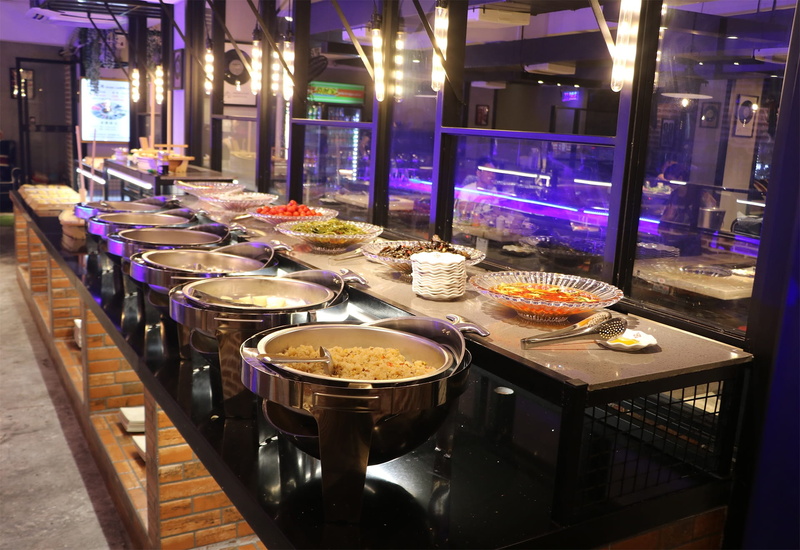 scenery, preparing food, table, restaurant, illuminated, no people, indoors, temptation, business, incandescent, commercial kitchen, food and drink, food