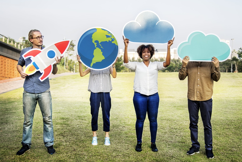 group of people, innovation, males, standing, globe, full length, grass, cloud, daylight, women, emotion, 2K, teamwork, casual clothing, looking at camera