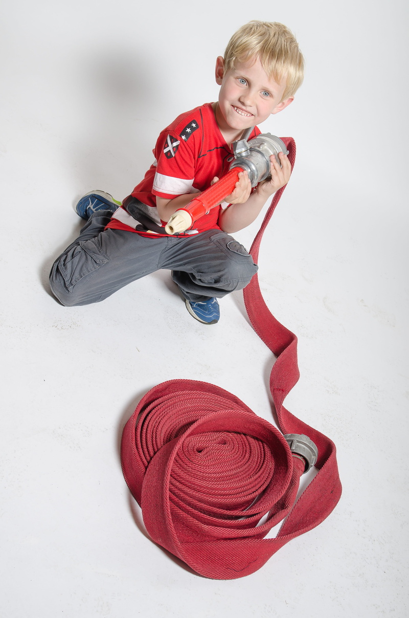 full length, happiness, 4K, looking at camera, child, play, children, volunteer firefighter, boys, warm clothing, men, front view, young, human, one boy only