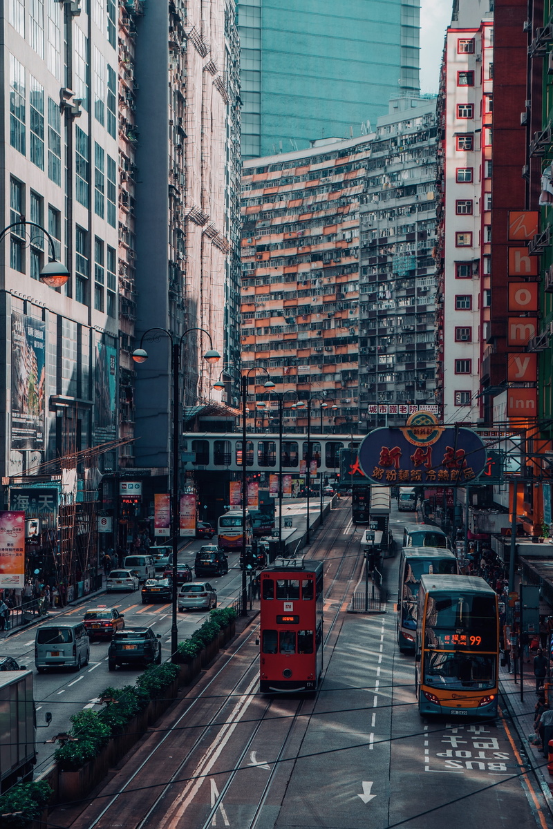 asia, hongkong, high angle view, motor vehicle, transport, cityscape, incidental people, roadside, mode of transportation, skyscraper, outdoors, architecture