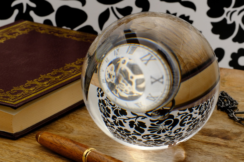 indoors, globe - man made object, filler, the past, history, clock, publication, pattern, sphere, glass ball, close-up, communication, personal accessory